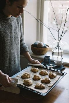 Girl holding a tray of cookies