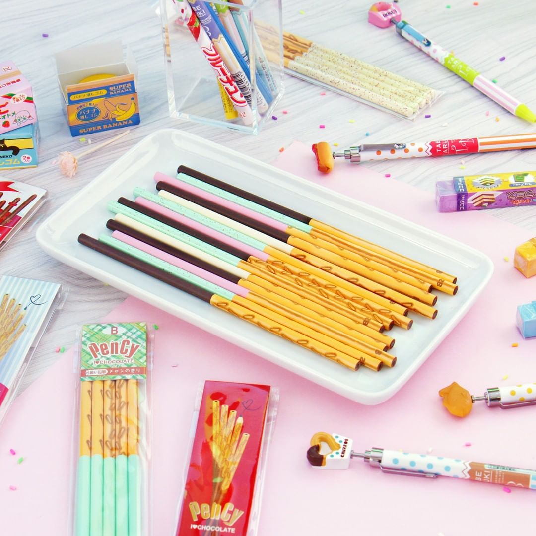 realistic pocky stick pens on a plate