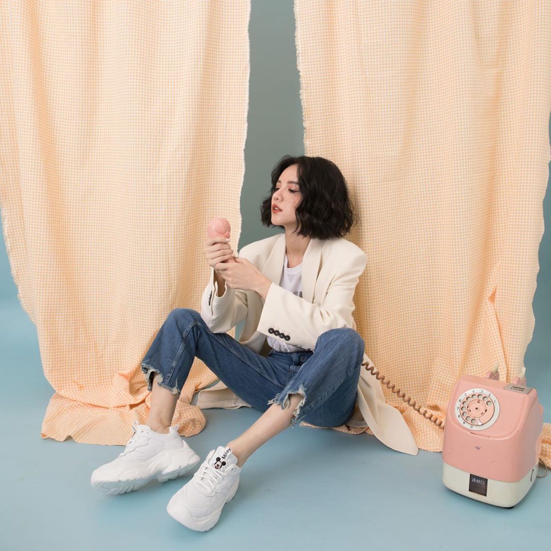 Model posing with Grace Gift Disney Mickey Mouse chunky sneakers