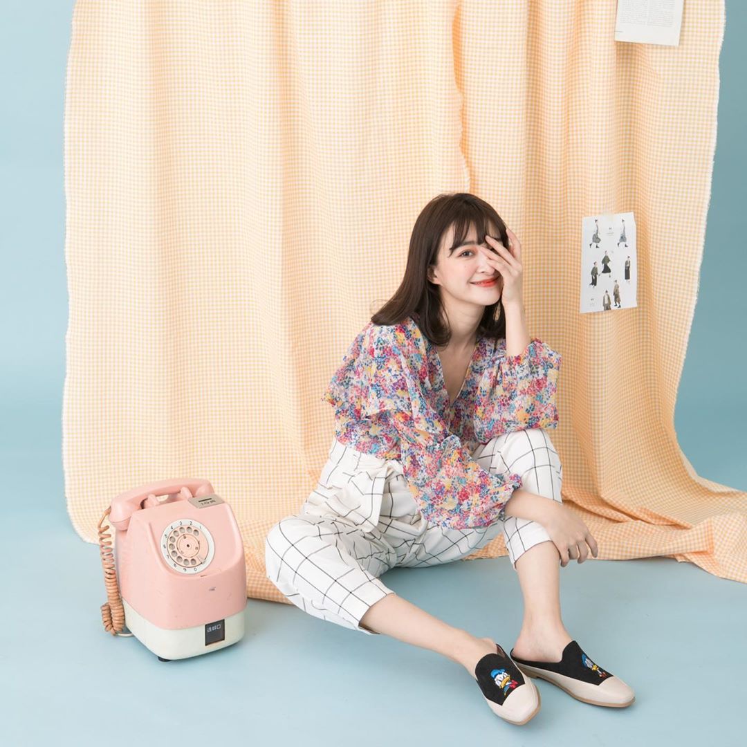 Model wearing Grace Gift Disney Donald Duck square toe mules