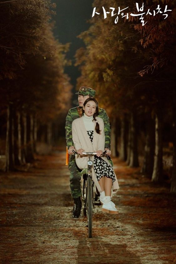 Son Ye Jin sitting on a bicycle in Crash Landing on You