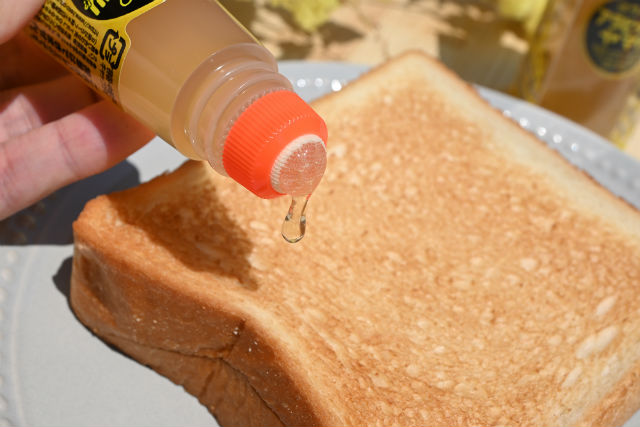 spreading honey on toast using Arabic Yamato glue stick