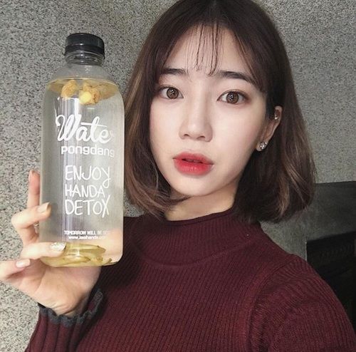 Girl holding detox water
