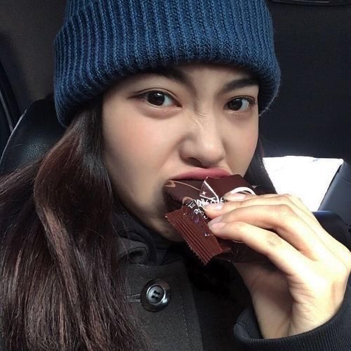 Asian Lady Snacking