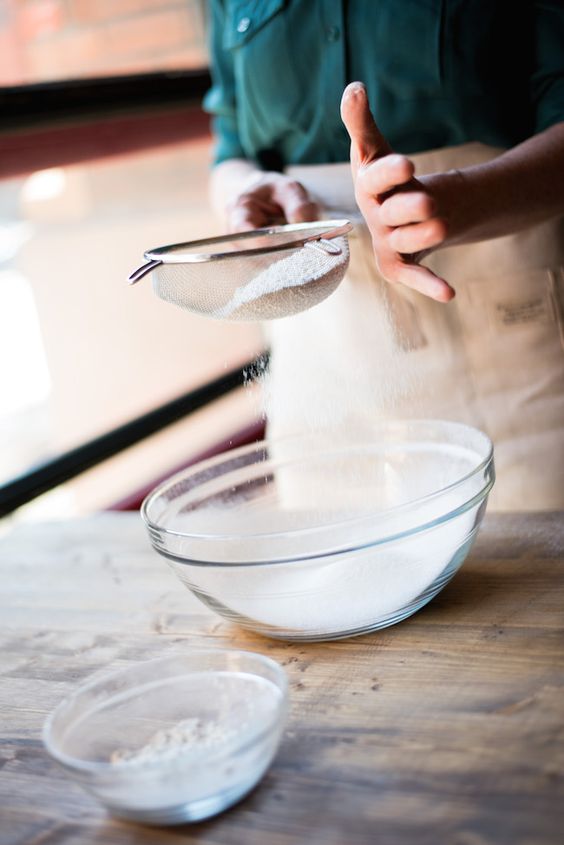 Sifting flour while baking