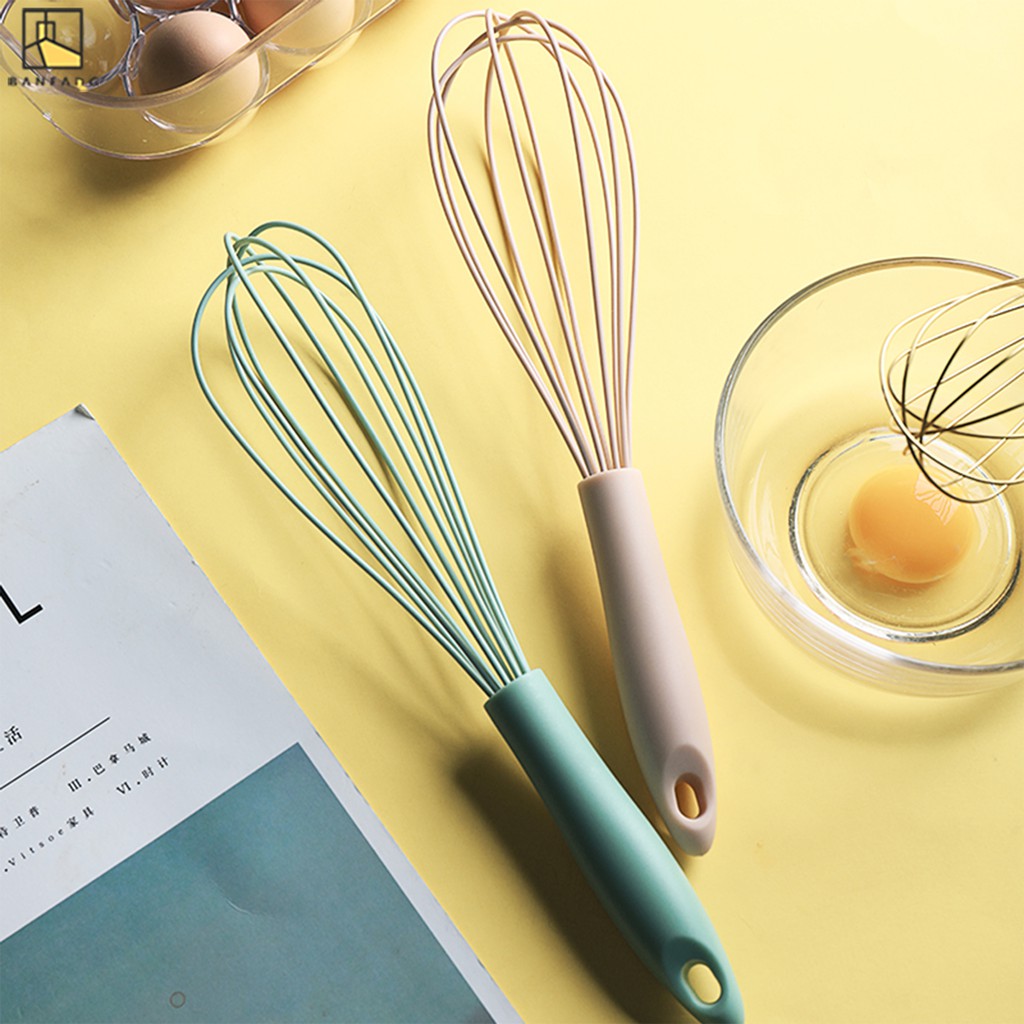 Blue and pink whisks