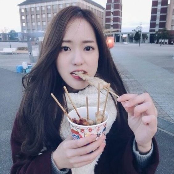 woman eating Fish cake soup Eomuk tang in Korea