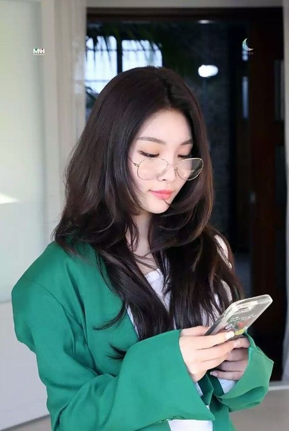 Asian Girl Looking At Phone