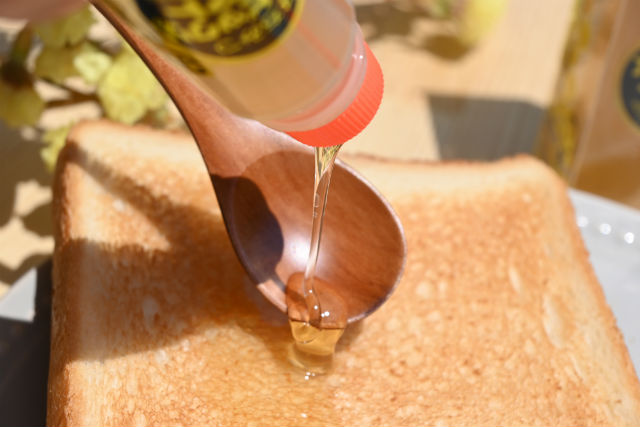 squeezing honey onto spoon and toast using glue stick