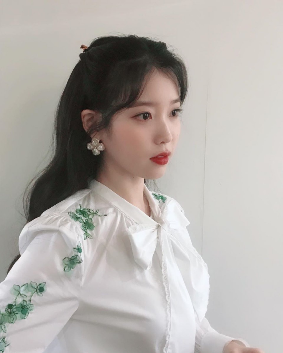IU korean singer wearing white blouse