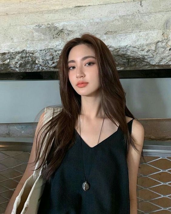 asian woman wearing black camisole top