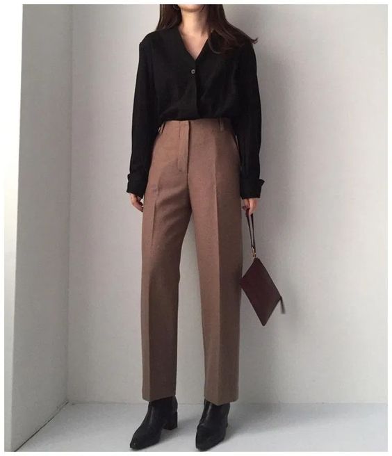 asian woman wearing black shirt and pink trousers