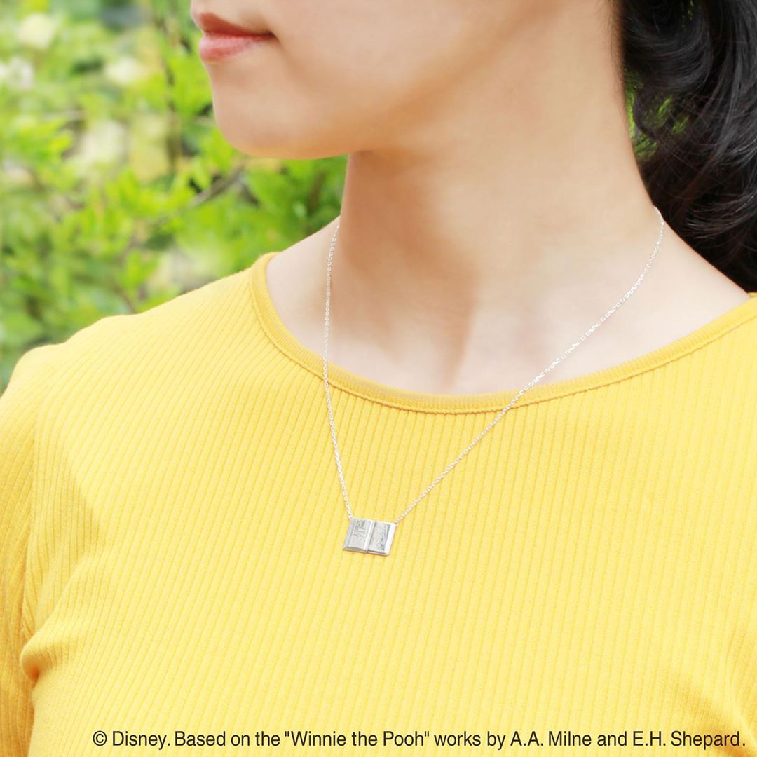 Wearing the Winnie-the-pooh necklace