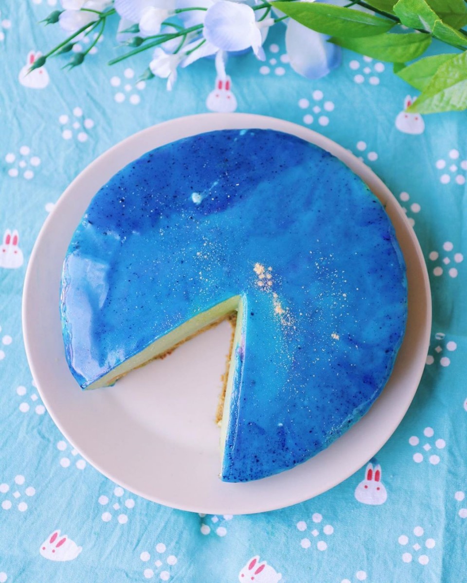 galaxy Mirror Glaze matcha cake with one slice cut out