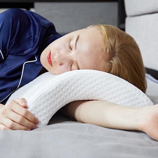 Girl using curved pillow by herself