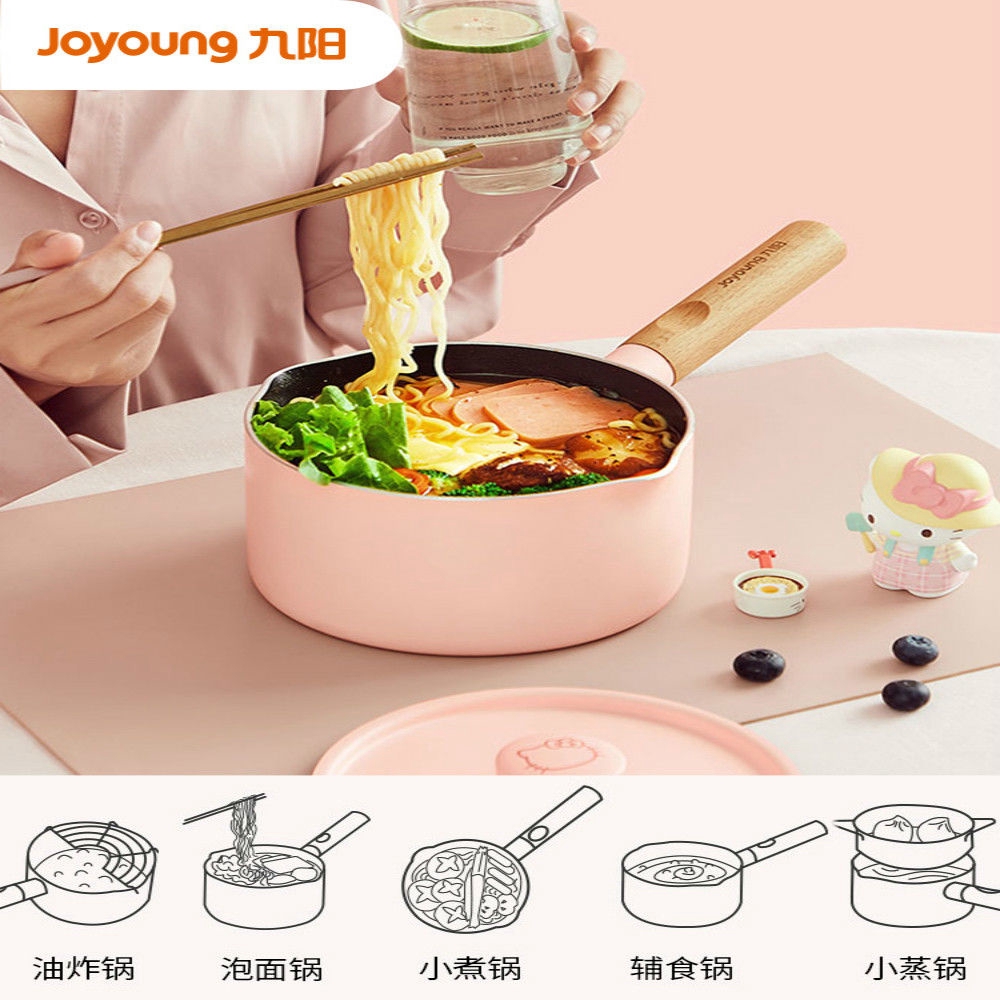 woman eating instant noodles in pink joyong Hello Kitty mini pot