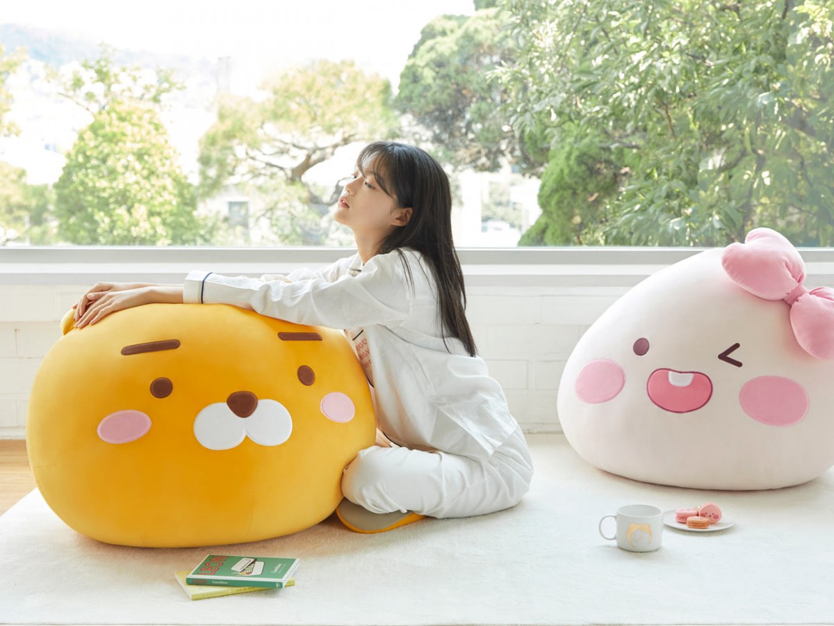 girl sitting on the floor with Mega Face Cushion-Ryan