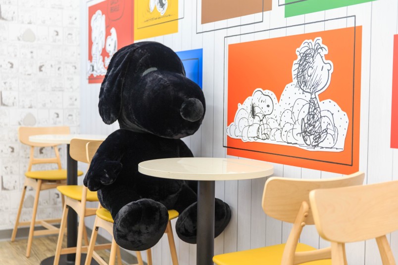 Snoopy-themed 7-Eleven Taipei Taiwan dining area with black snoopy plushie