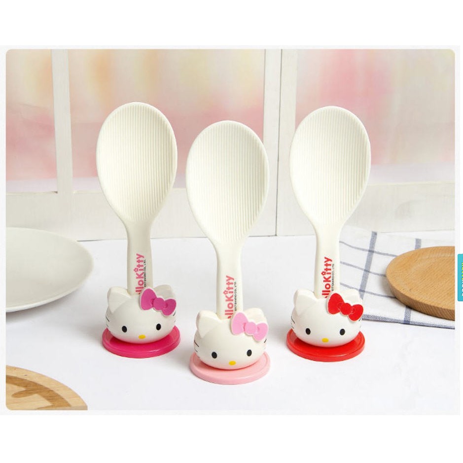 three Hello Kitty rice paddle in red and pink