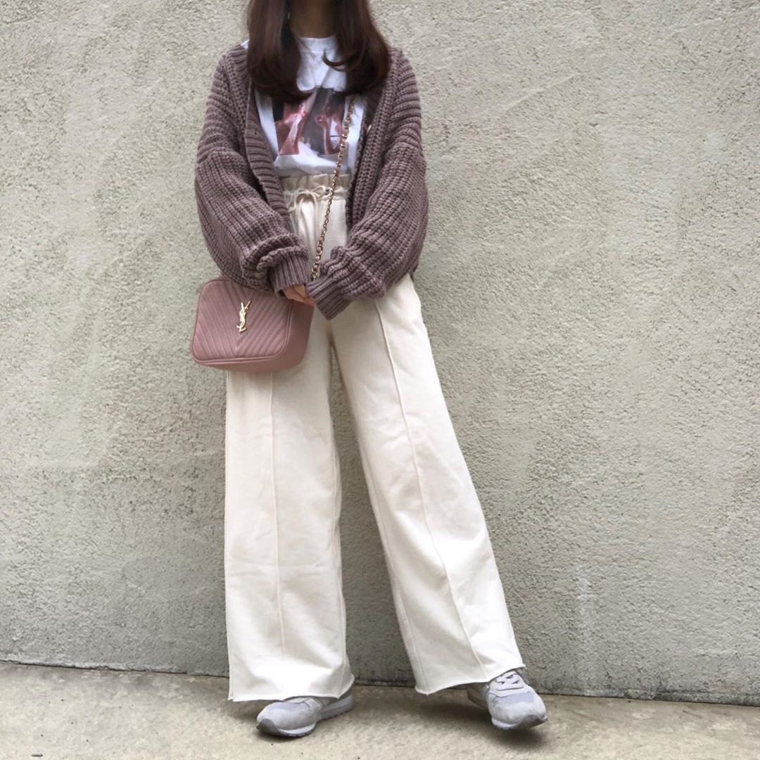 girl wearing brown cropped sweater and trousers with boots