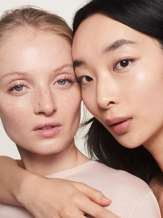 Glossier models wearing concealer