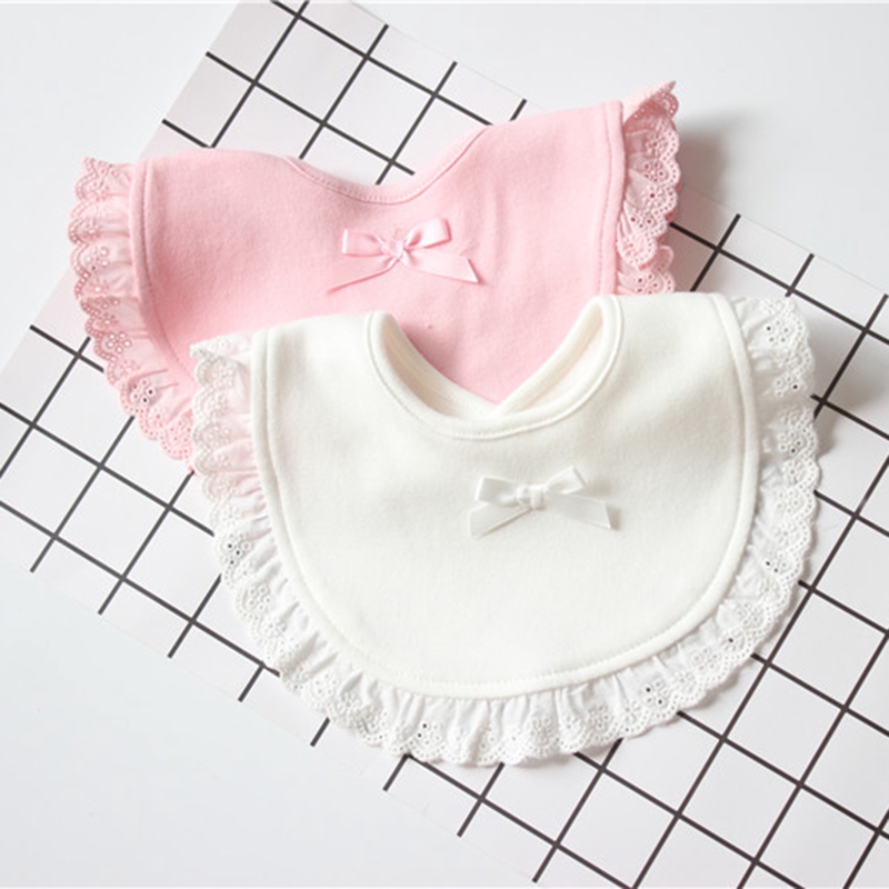 pink and white bibs with frills and bow