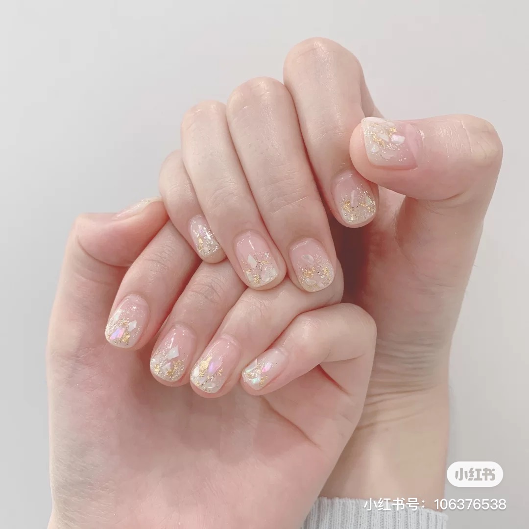 White crushed shells nail art