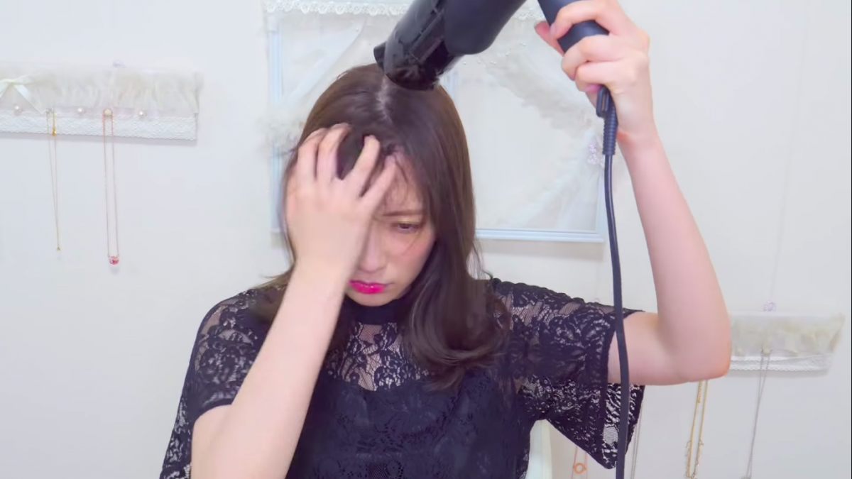 Akari Yoshida blow drying bangs