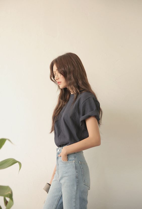 asian woman wearing black t shirt and jeans