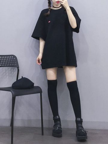 asian woman wearing oversized t shirt dress and high socks