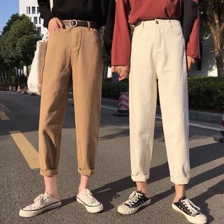 Two girls wearing straight cut pants