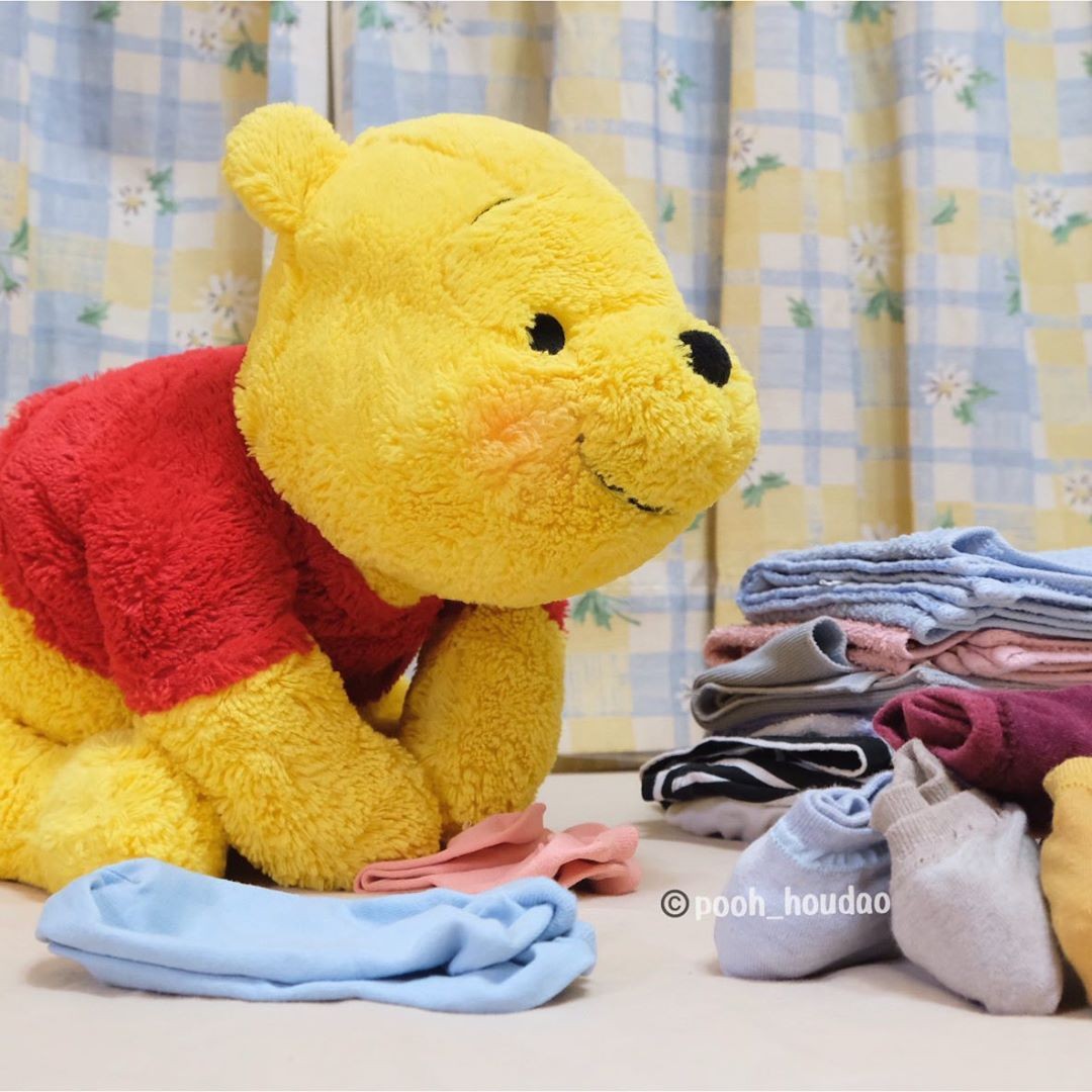 winnie-the-pooh plush toy daily life folding socks