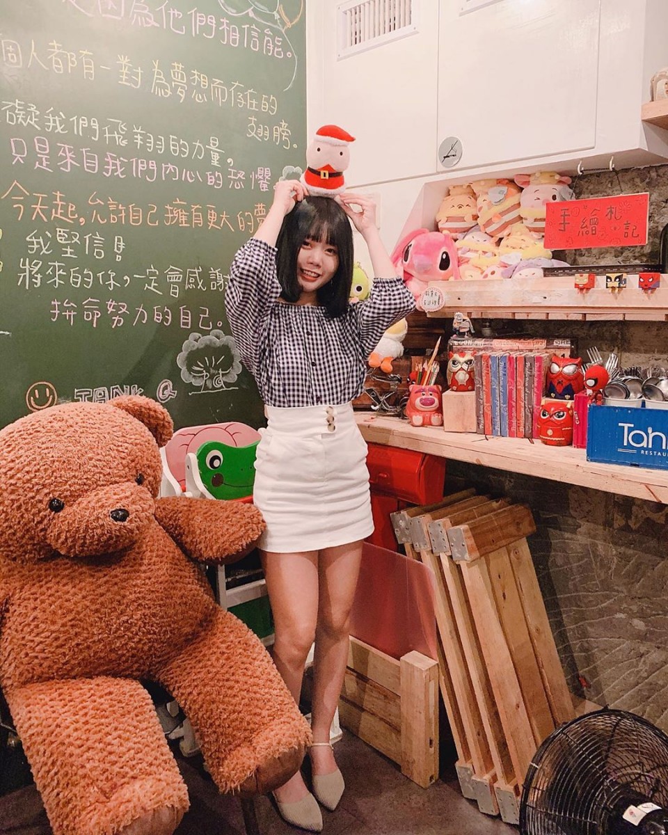 girl posing with bear toy at TankQ Cafe & Bar