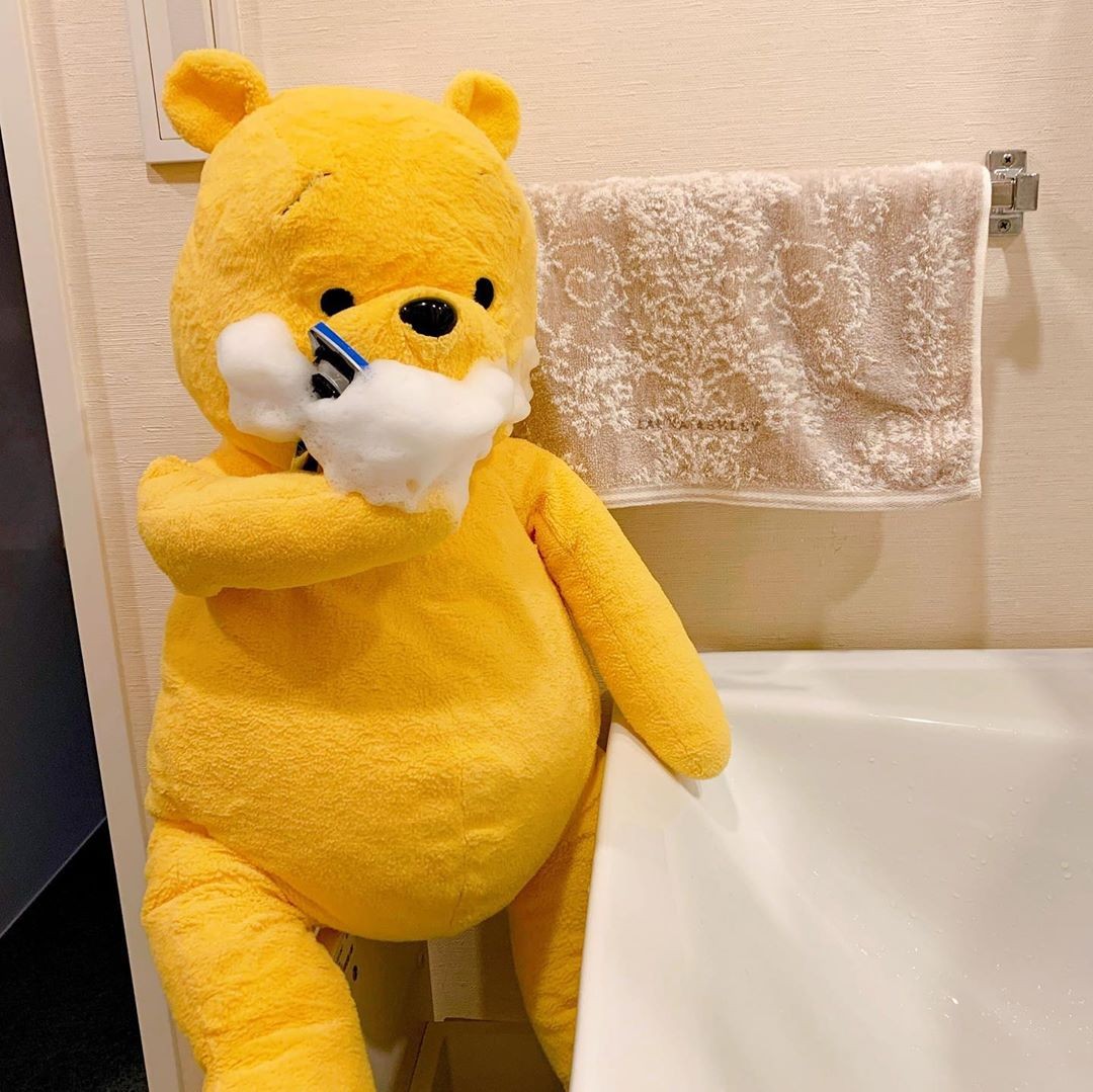 winnie-the-pooh plush toy daily life shaving face in bathroom