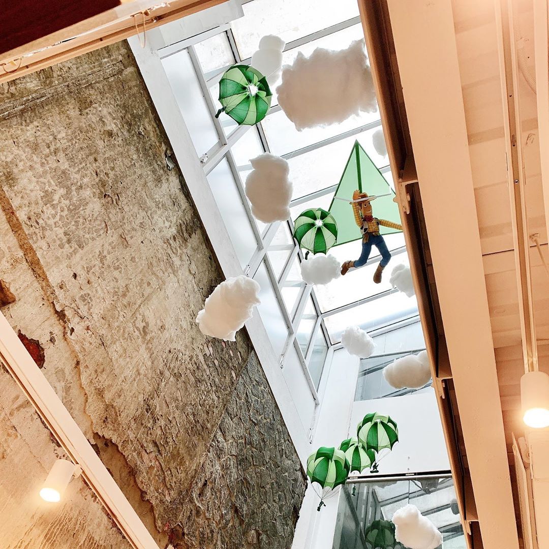real life green army men parachuting through stair banisters to investigate Andy's birthday presents