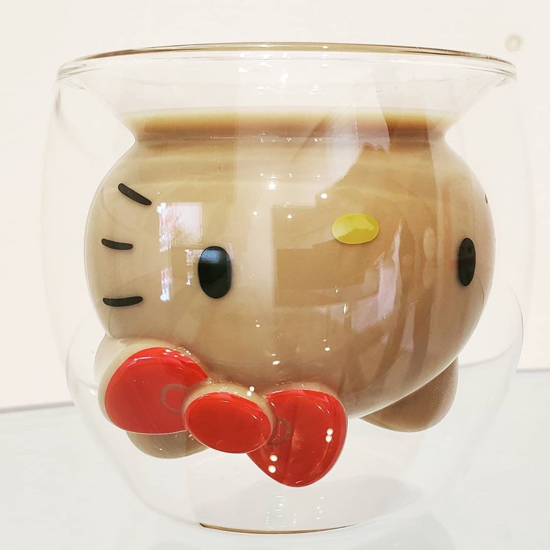 Goodglas Hello Kitty red glass filled with brown drink