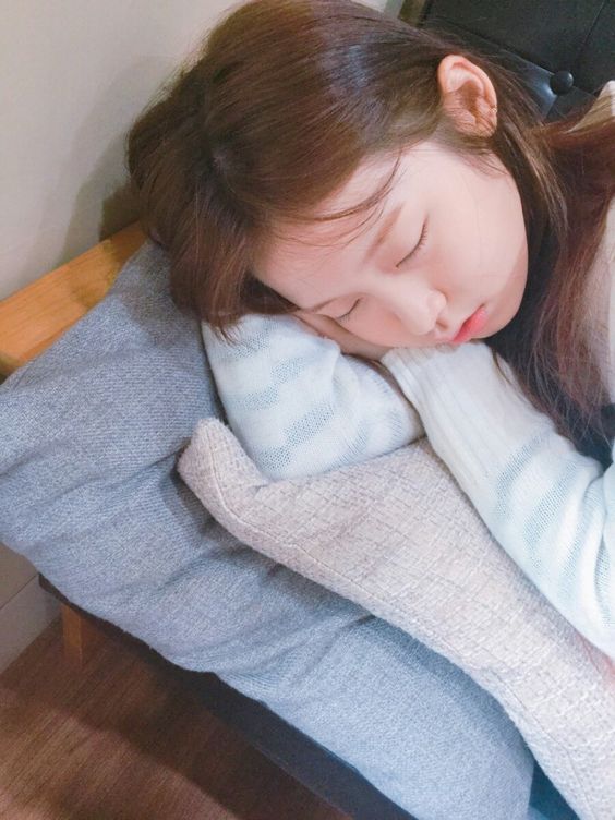 asian girl sleeping on arm