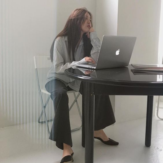 asian girl working on her laptop