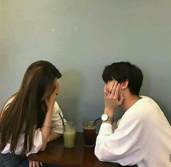 asian couple chatting with drinks