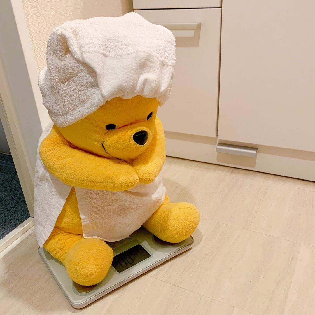 winnie-the-pooh plush toy daily life checking weight on weighing machine
