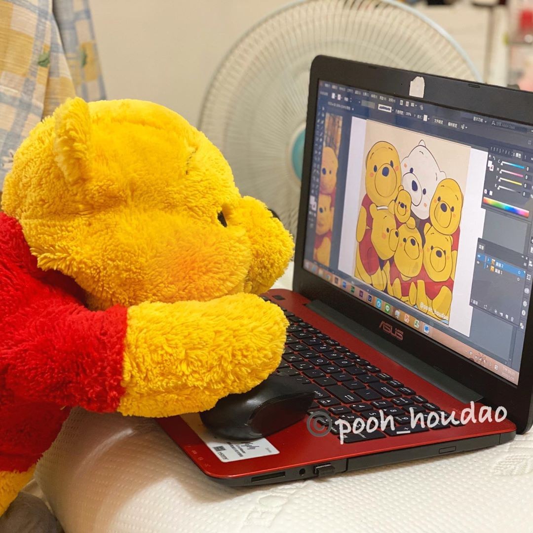 winnie-the-pooh plush toy daily life photoshopping picture on laptop