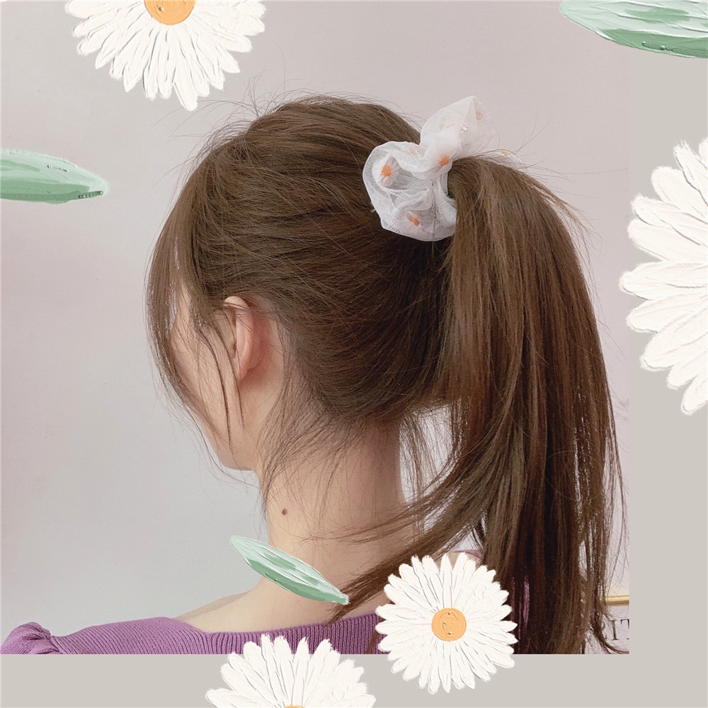 girl with hair tied up in a ponytail using white Mesh floral hair tie scrunchie