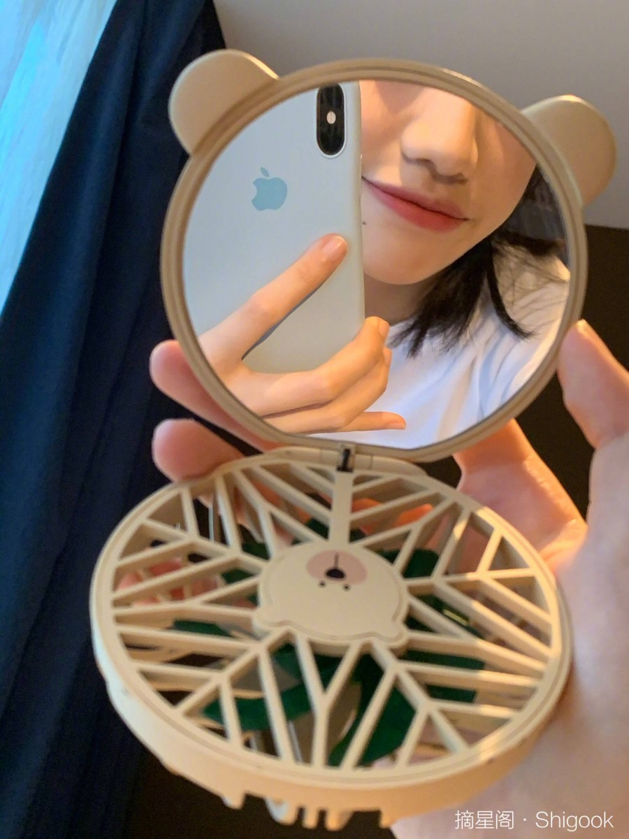 Mirror attached to Starbucks China portable fan