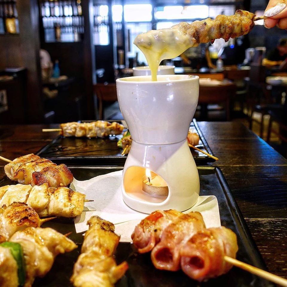 skewers dipped in cheese at Sumire Yakitori House