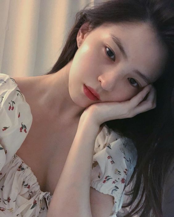 asian girl looking sad resting head on hand
