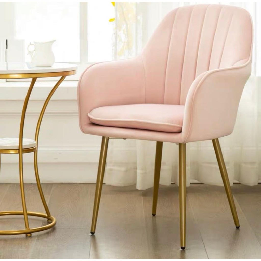 Pink velvet chair with armrest and golden legs