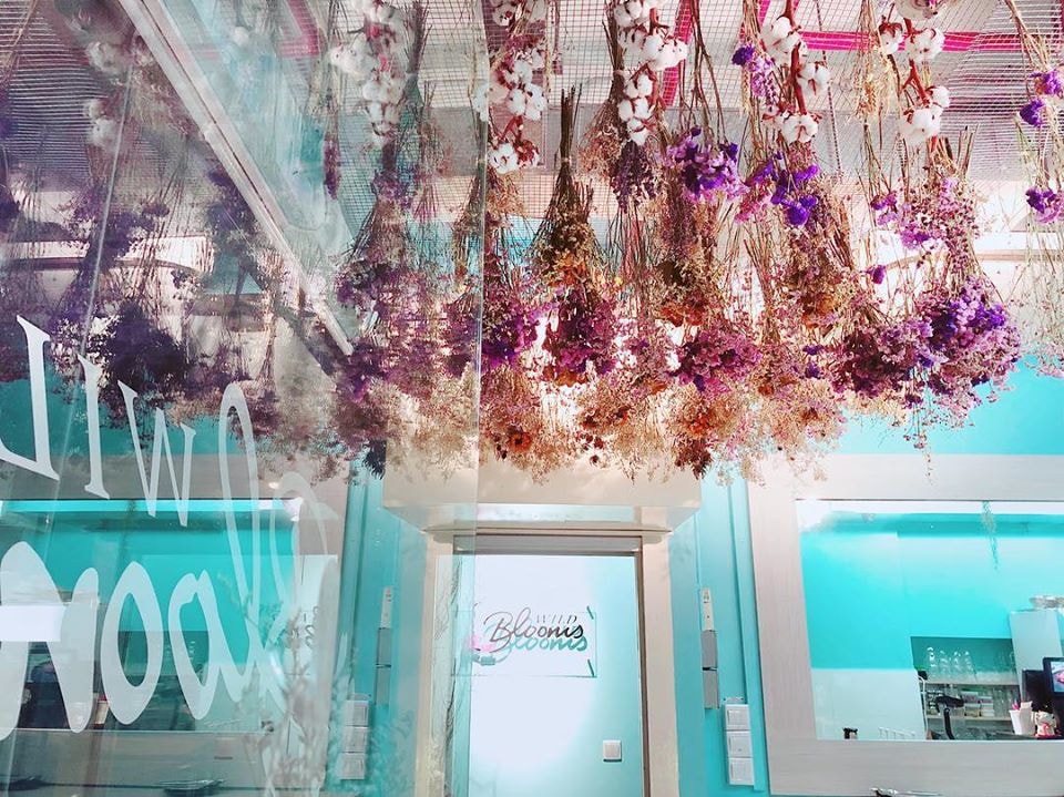 hanging florals on ceiling at Wild Blooms