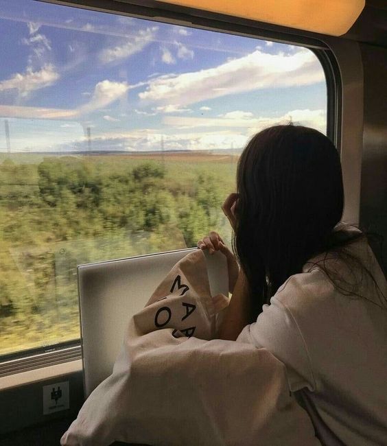 Girl on holiday in a train
