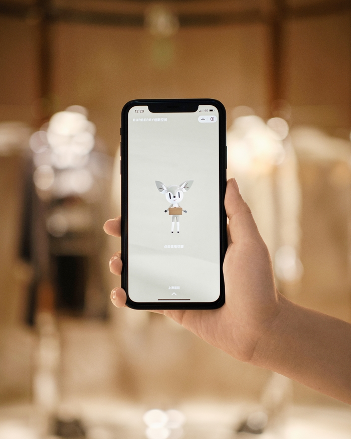 mobile phone showing Burberry Open Spaces app character