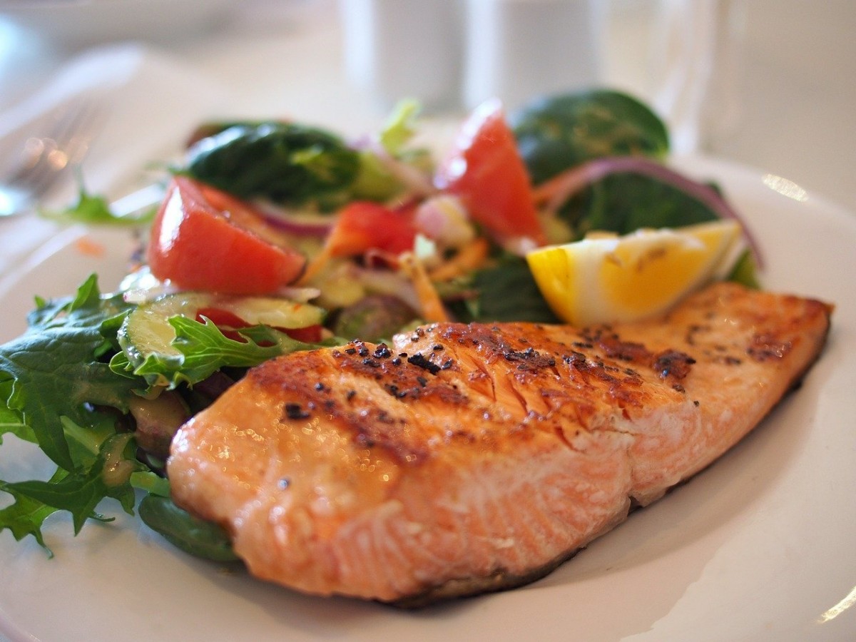 cooked salmon with a side of veggies